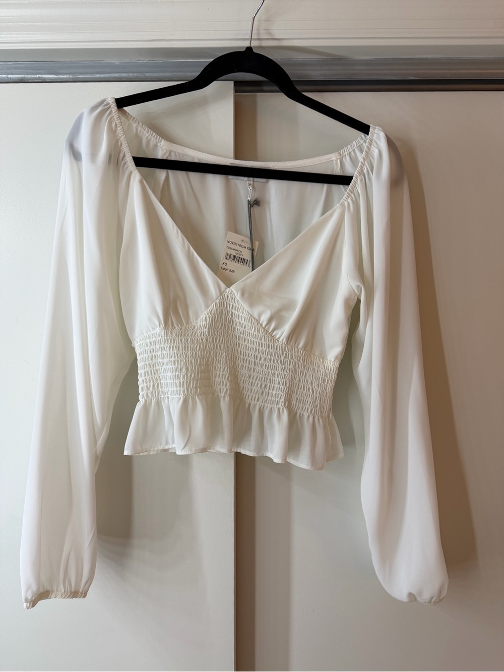 Women's White Smocked Peplum Long-Sleeve Top